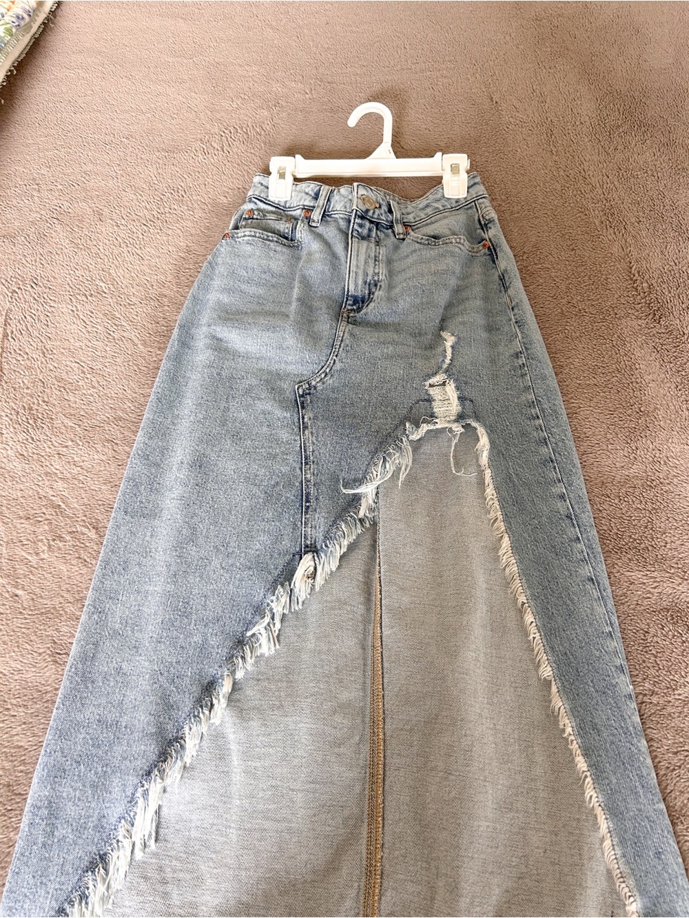 Light wash distressed denim skirt